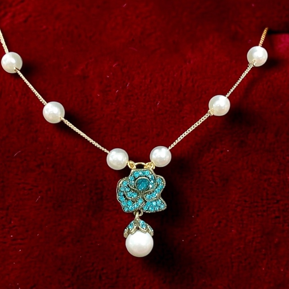 Heidi Daus Elegant Pearl and Floral Pendant With Swarovski Crystals